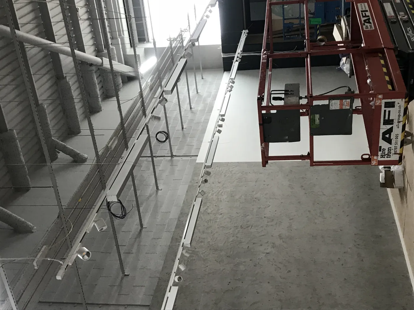 Lighting and track installation at height from scaffold towers by DTF Electrical